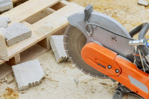 Concrete cutting with saw blade at construction at reconstruction area. Closeup