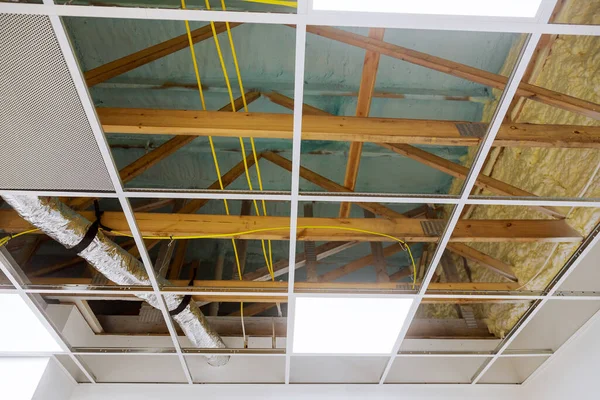 Metal frame of suspended ceilings making of false the ceiling of the office room.