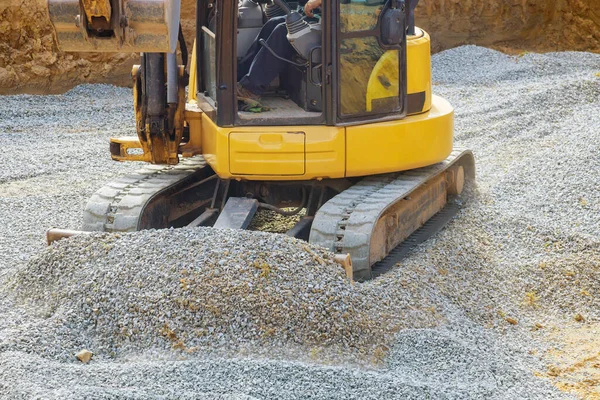 Loading of stone excavator works in a gravel pit