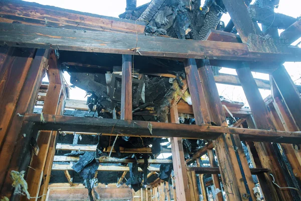 Interior of a home damaged wall after a fire in a wooden house