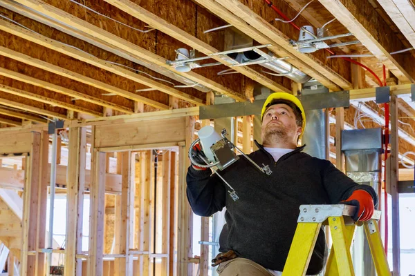 Installation electrical for light bulb hanging lamp on the ceiling maintenance construction