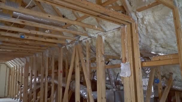 New home construction with installation of termal insulation installing at the attic — Stock Video