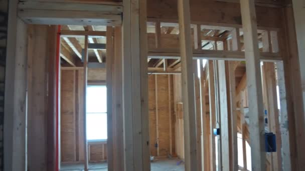 Beams the view of interior of frame house under construction residential house in American — Stock Video