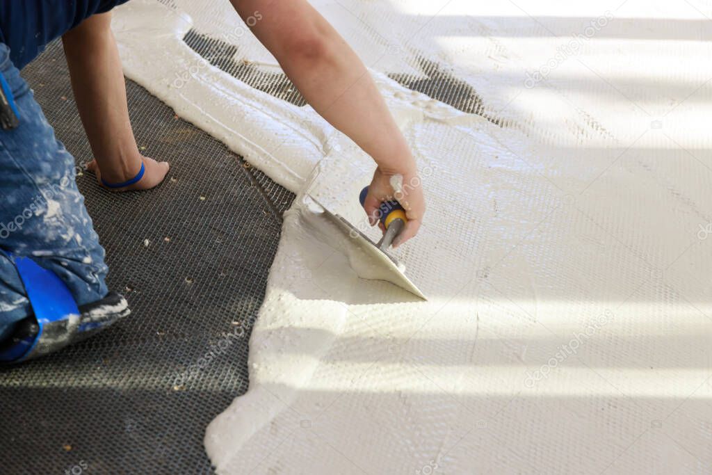 Prepare the cement for construction using trowel to mix mortar unfinished laying floor tiles
