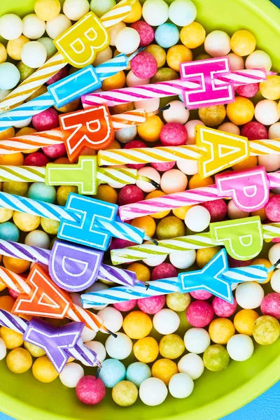 Candles on a birthday and candy — Stock Photo, Image