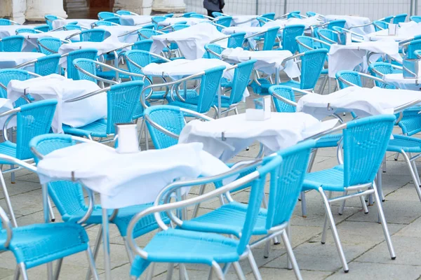 tables of street cafes in Italy