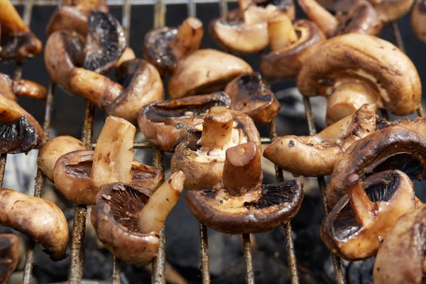 Appetizing tasty fried mushrooms on the grid — Stock Photo, Image