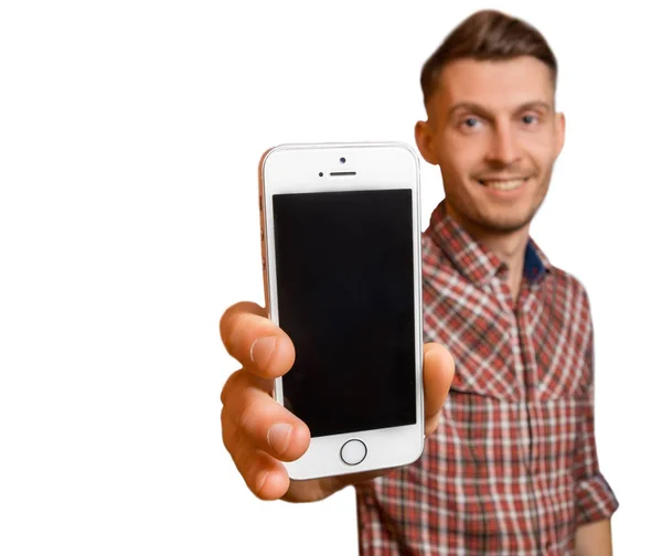 Atraktivní mladý muž nebo teenager ukazující jeho mobilní telefon Stock Fotografie