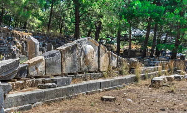 Ruins of the Ancient Theatre in the greek city of Priene in Turkey on a sunny summer day