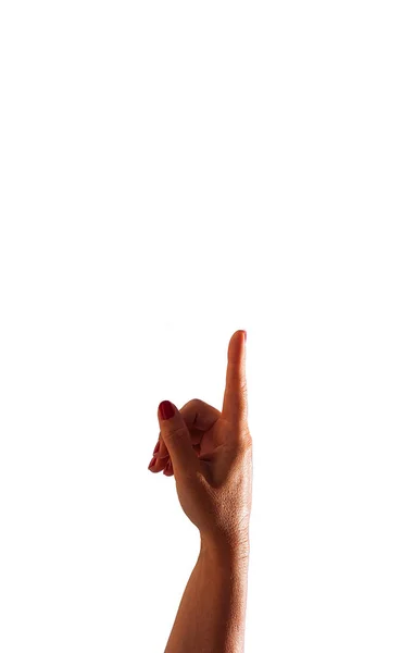 Kvinnans hand pekar med fingret på vit bakgrund — Stockfoto