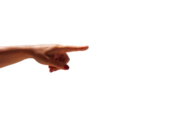 Kvinnans hand pekar med fingret på vit bakgrund — Stockfoto