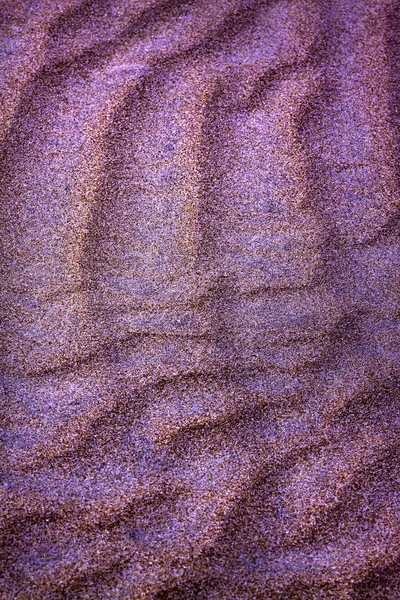 CLOSE UP OF FORMS OF TEXTURE IN THE BEACH SAND ON THE COAST OF CADIZ IN SPAIN — Stock Photo, Image