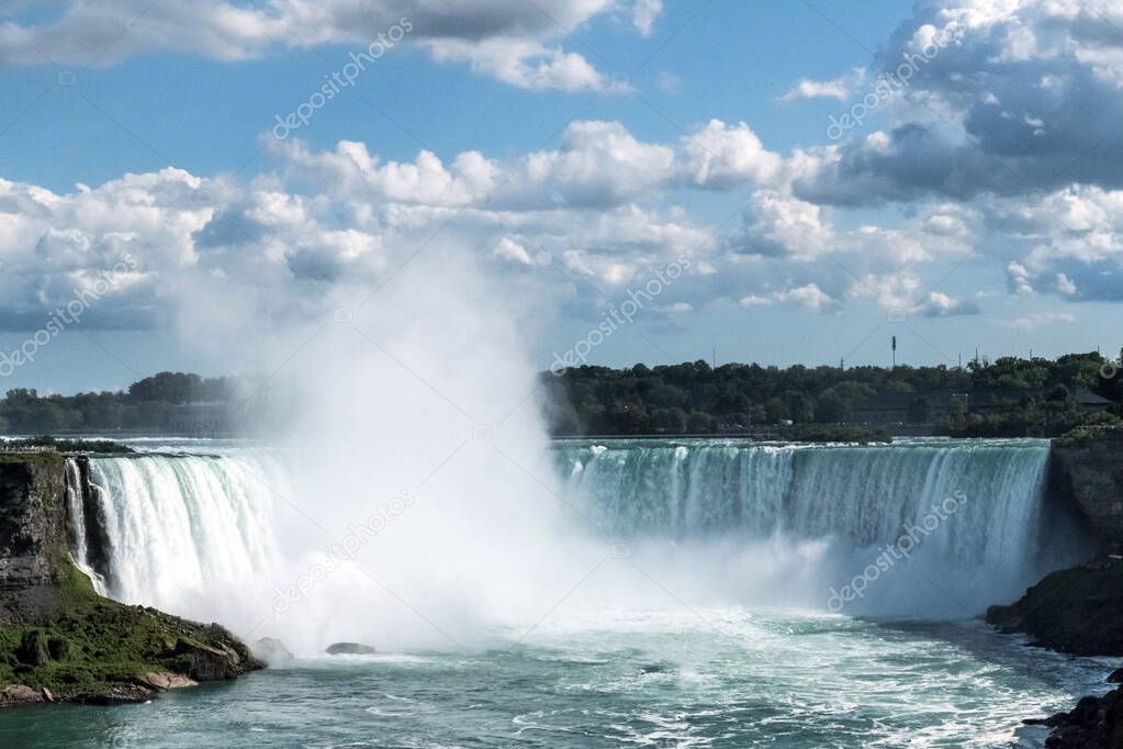 Horseshoe Falls, also known as Canadian Falls on a summer day, is the largest of the three waterfalls that collectively form Niagara Falls on the Niagara River along the CanadaUnited States