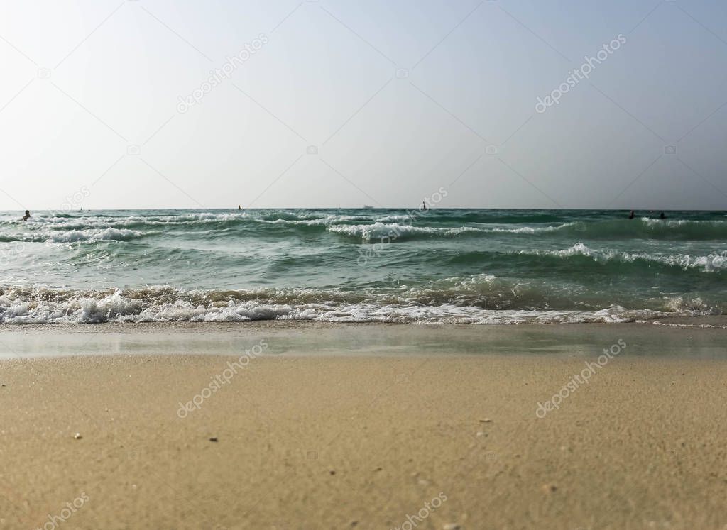 Horizon of seascape, sandy beach in Dubai, United Arab Emirates