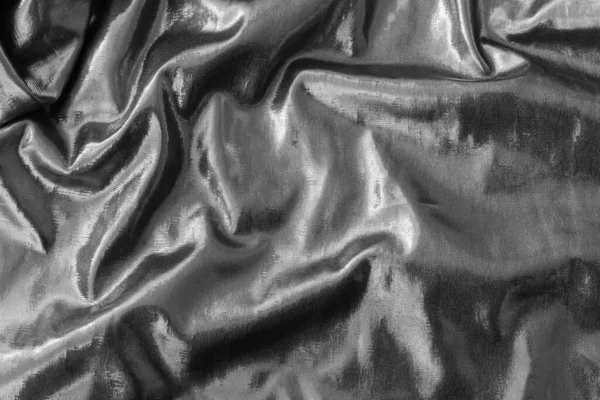 Real wrinkled abstract foil textureback ground in silver color.