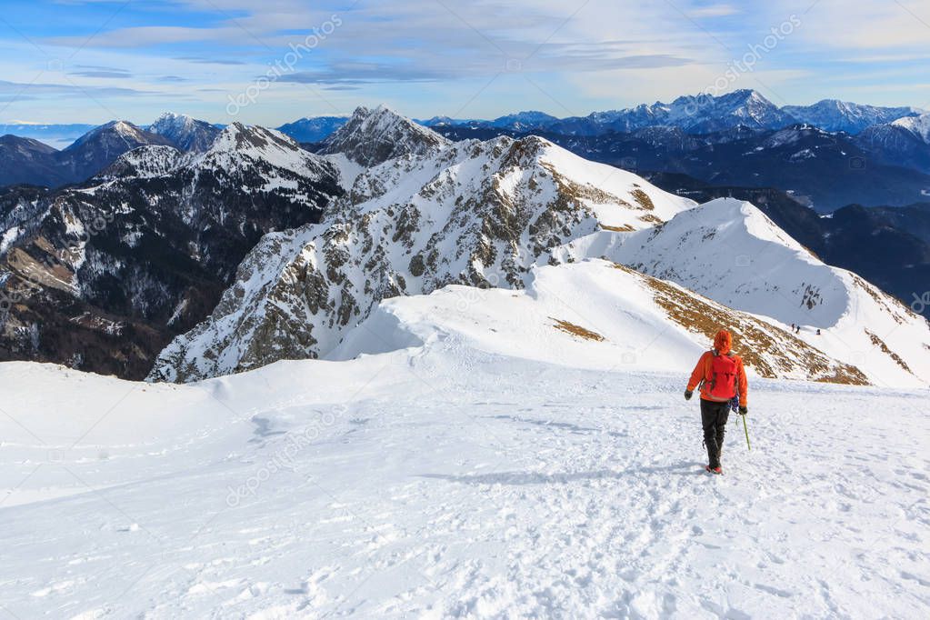 The mountaineer walking on the top of the ridge of the Begunjscica mountain, Slovenia