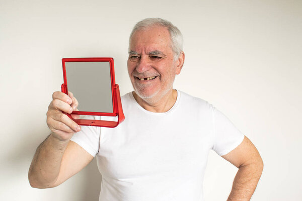 old man senior face closeup missing tooth smile proper tooth care