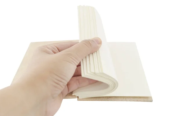 Mão livro aberto no fundo branco — Fotografia de Stock