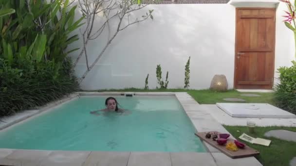 Girl Swims Small Pool Villa — Stock Video