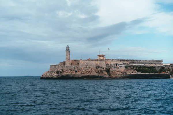 Old stone fort with a lighthouse on the Caribbean in Havana