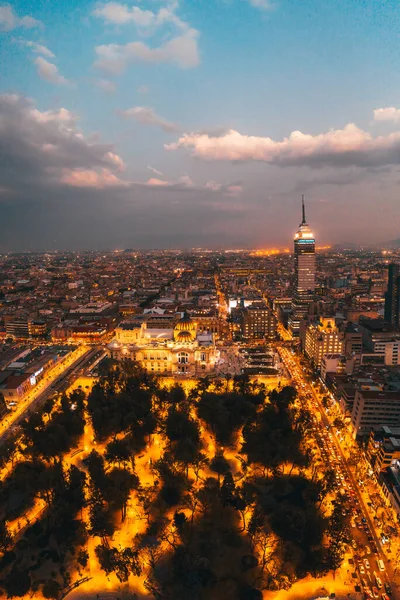 View from the drone of the streets and houses of the metropolis in Mexico City at sunset