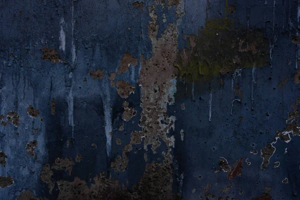 Abstract art texture background. Creative wall art close up. Beautiful dark background. Paint on the wall. Blue, grey and green old cracked concrete wall surface