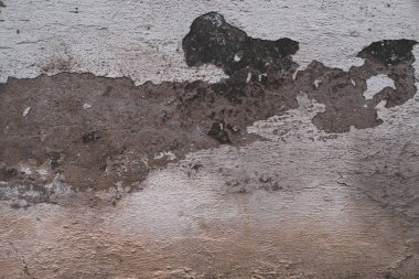 Tahıllı ve çizikli eski renkli duvarın soyut grunge dokusu. Yaratıcı bir geçmiş. Gri, turuncu, siyah ve kahverengi güzel, yıpranmış taş dokusu. Boşluğu kopyala