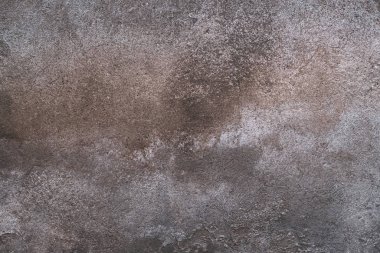 Tahıllı ve çizikli eski renkli duvarın soyut grunge dokusu. Yaratıcı bir geçmiş. Gri, turuncu ve kahverengi güzel, yıpranmış taş dokusu. Boşluğu kopyala