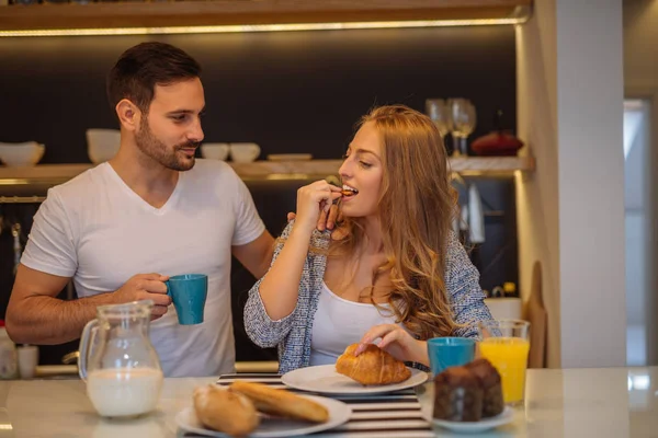 Eating a croissant — Stock Photo, Image