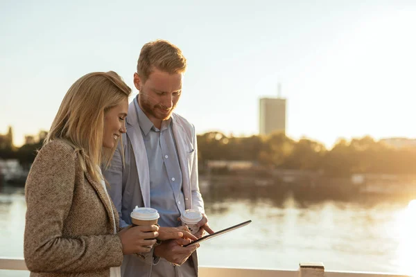 Colleagues talking outdoors