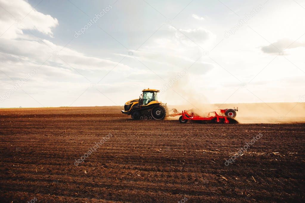 Agricultural mechanization on sunset