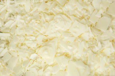 Mum yapımı için beyaz soya gevreğini kapatın. Soya mumu taneciklerinin hafif dokusu. Ev yapımı mumlar için. Ekolojik yaşam tarzı