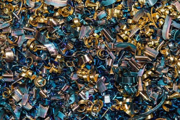 Industrial waste in the form of sharp metal chips. Industrial metal debris.