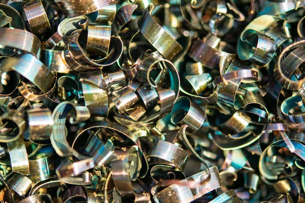 Industrial waste in the form of sharp metal chips. Industrial metal debris.