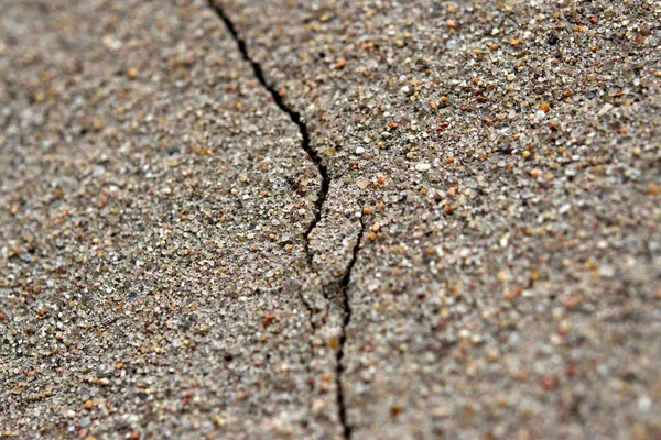 Текстурированная Песчаная Штукатурка Крупным Планом Глубокой Трещиной — стоковое фото