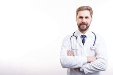 Smiling Bearded Doctor in White Coat With Stethoscope Posing
