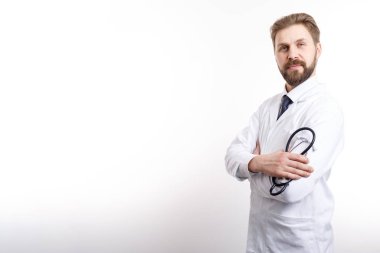 Smart Smiling Doctor Posing Half-turned With Stethoscope, Arms Crossed