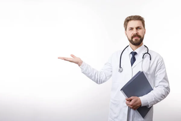 Handsome Bearded Doctor With Stethoscope Keeping His Hand Stretched Aside — 图库照片