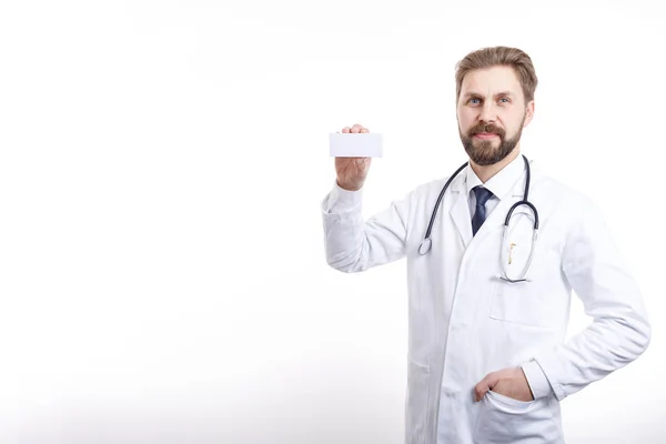 Smiling Doctor Demonstrating a Carton of Drugs — ストック写真