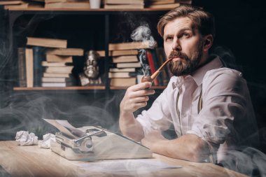 Pensive Male Author Smoking Pipe and Thinking