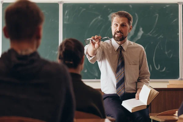 Bearded Teacher Asking His Student a Question