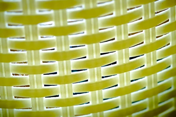The texture of the plastic mesh light from the inside, low light, black background