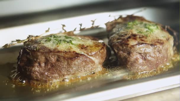 Meat fillets in butter baked in oven. Slow motion. — Stock Video