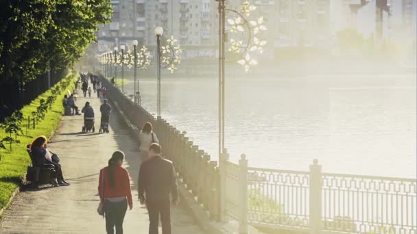 People walking on waterfront — Stock Video