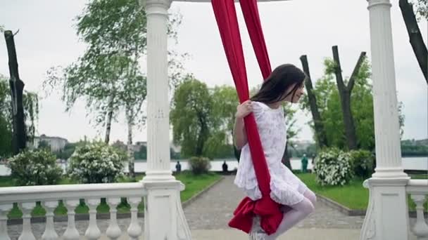 Girl swinging on aerial ribbons — Stock Video