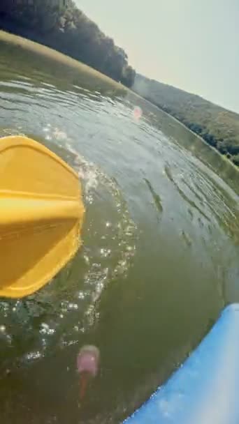 A yellow paddle for white water rafting and kayaking. POV view — Stock Video