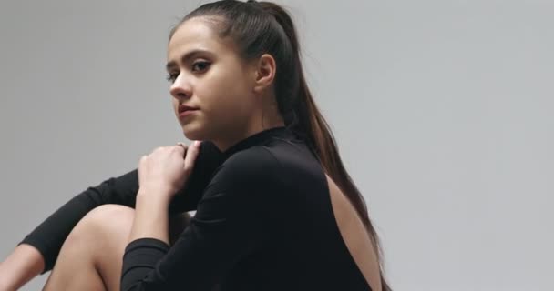 Young woman on black bodysuit — Stock Video