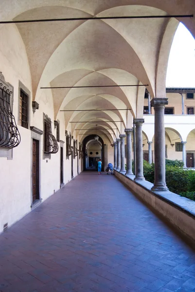 Corridor in a Tuscan architecture with a Gothic arcade