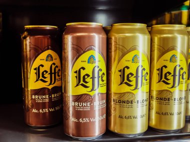 Charleroi, Belgium - December 28 2019 : Leffe Blonde and brown belgian beer cans in a grocery store
