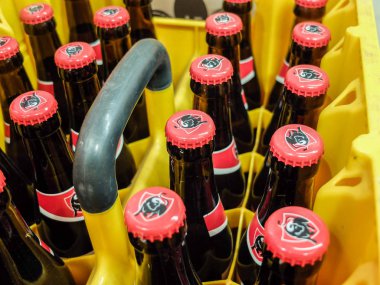 Charleroi, Belgium - December 28 2019 : Jupiler blonde Belgian beer caddy in a grocery store. Casier de Jupiler, pack de 24